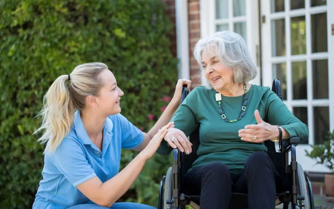 Loving caregiver embracing senior resident at EverBloom